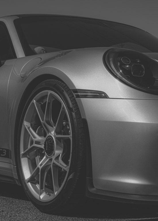Closeup black and white photo of a Porsche GT3, by Seb Duper