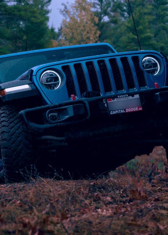 Low-angle photo of a blue Jeep Wrangler by Seb Duper