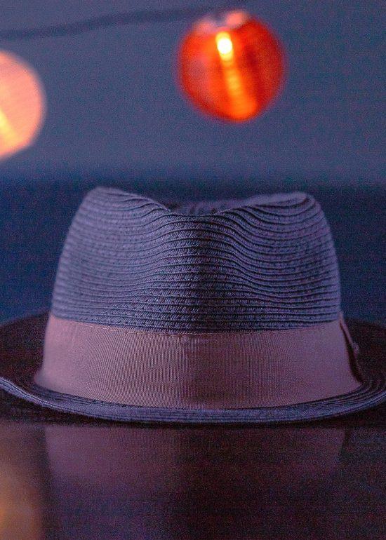 Creative product photography by Seb Duper - a fedora hat sits on a table.