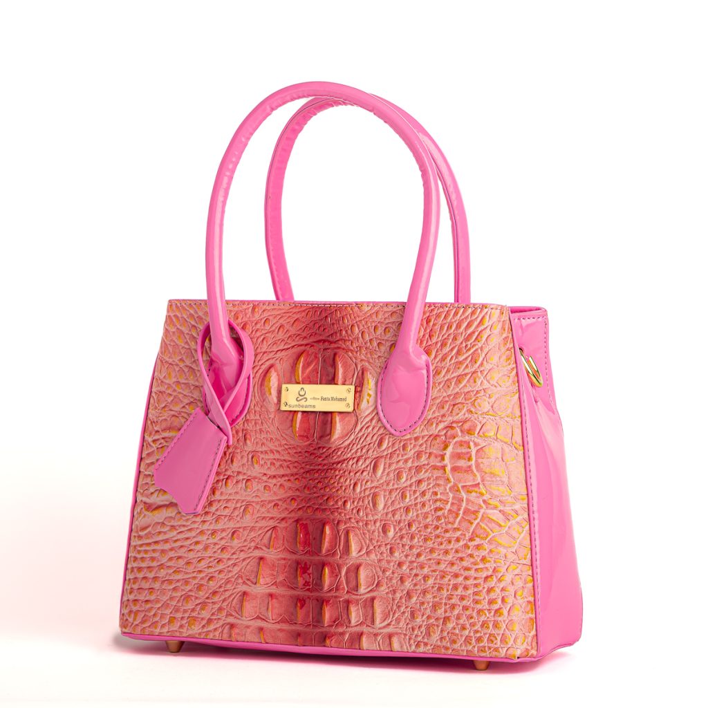 A pink handbag against a white background