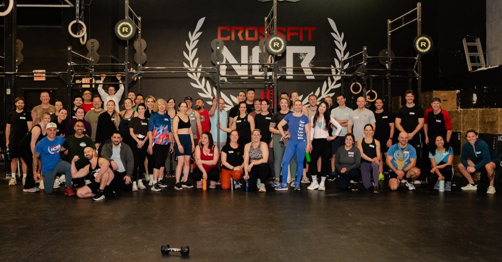 A group of male and female athletes poses for a group portrait during a networking event held at Crossfit NCR, in Ottawa. 